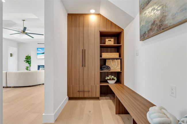 Mudroom with light wood-type flooring, ceiling fan, and built in features | Image 20