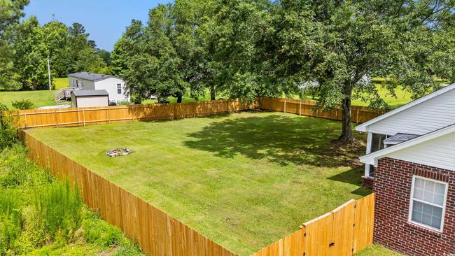 View of fenced backyard | Image 30