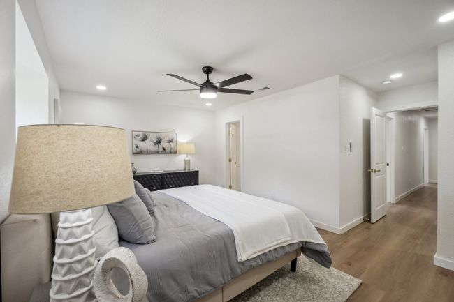 Bedroom with recessed lighting, wood finished floors, a ceiling fan, and baseboards | Image 18