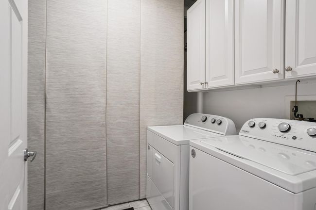 Laundry and Utility Room featuring Newer Washer and Electric Dryer + Newer A/C with High-Efficiency Gas Furnace | Image 24