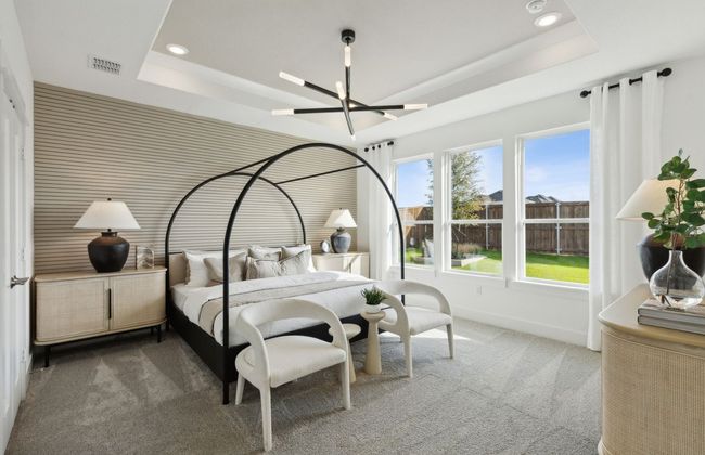 Elegant owner's suite with large windows *Photos of furnished model. Not actual home. Representative of floor plan. Some options and features may vary | Image 16