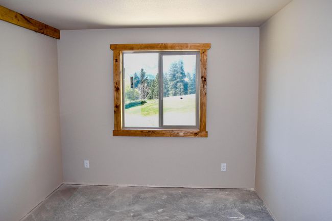 Spare room with unfinished concrete flooring | Image 27
