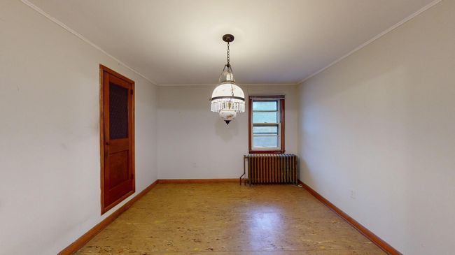Dining room with an inviting chandelier | Image 11