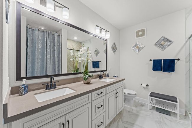 En suite layout with double sinks and spacious design, offering functionality and a strong foundation for personalization. | Image 13