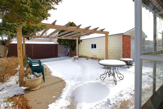Snow covered patio featuring a pergola and a patio | Image 18