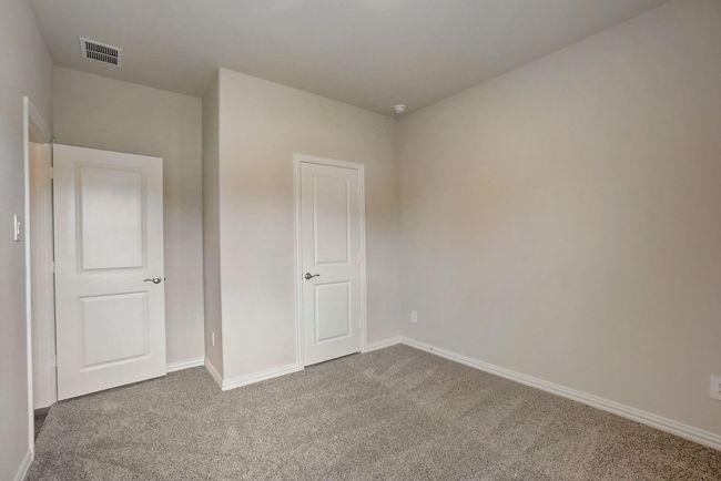 Unfurnished bedroom featuring carpet floors and baseboards | Image 16