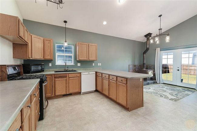 Kitchen, dining area and door to back patio. | Image 4