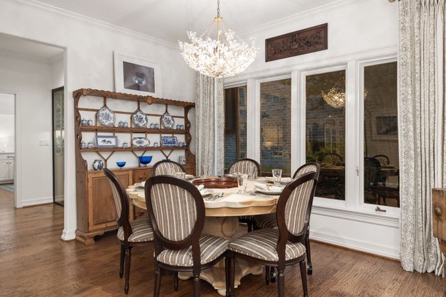 Large breakfast area with wood floors and large windows to allow for natural light | Image 13