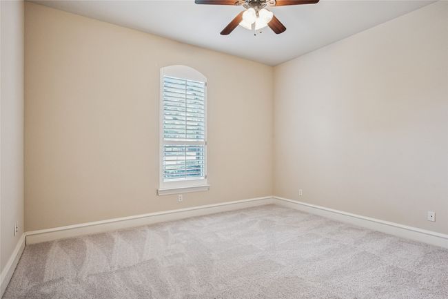 Secondary Bedroom with new carpet and plantation shutters. | Image 26