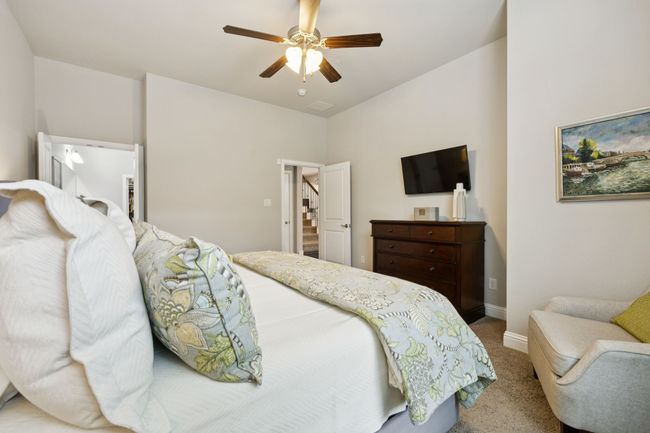Bedroom with carpet floors and a ceiling fan | Image 21