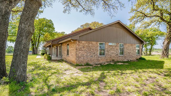 View of side of home with brick siding and a lawn | Image 32