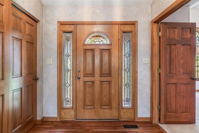 Foyer entrance with a textured ceiling, plenty of natural light, and hardwood / wood-style floors | Image 3