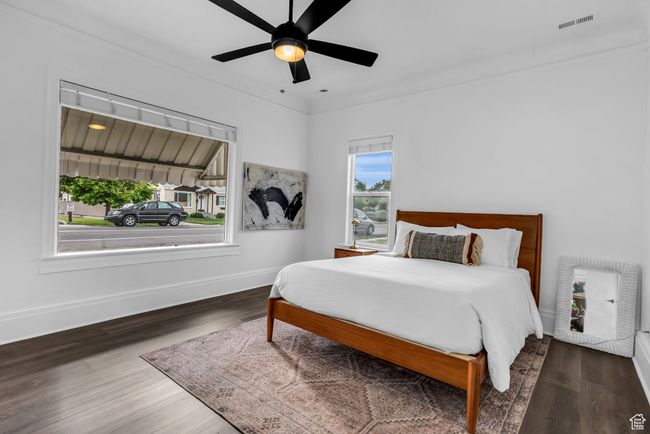 Bedroom featuring baseboards, wood finished floors, and a ceiling fan | Image 10