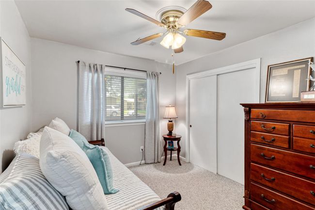 Additional view of Bedroom #3 offers a cozy & versatile space with a ceiling fan, great natural light, and a spacious closet for storage. | Image 18