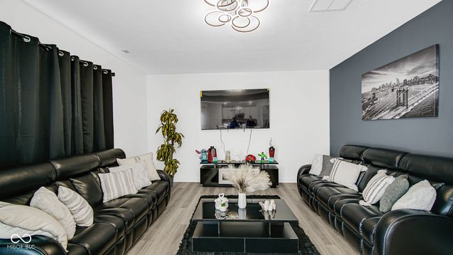 living room featuring wood finished floors and baseboards | Image 12