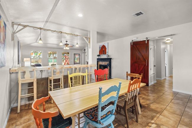 Extra bar area in dining room to watch tv. | Image 18