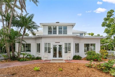 1912 home totally renovated to code, located on Pine Island Sound with 180 degree sunrise views across a wide expanse of beach. | Image 1