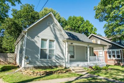 Back of property with a lawn and covered porch | Image 2