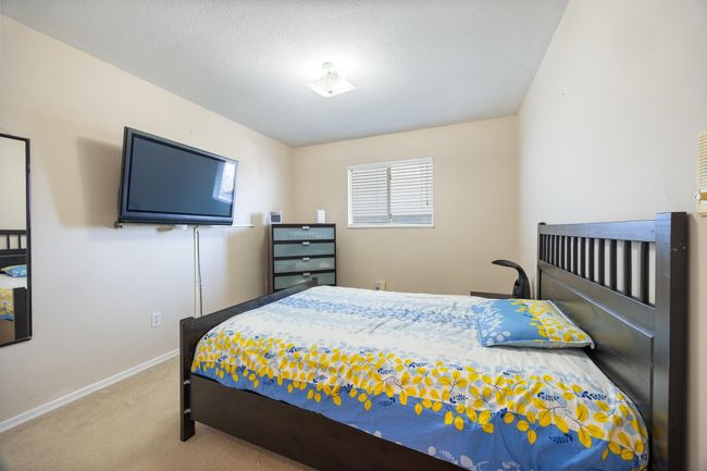 Bedroom with carpet and baseboards | Image 27