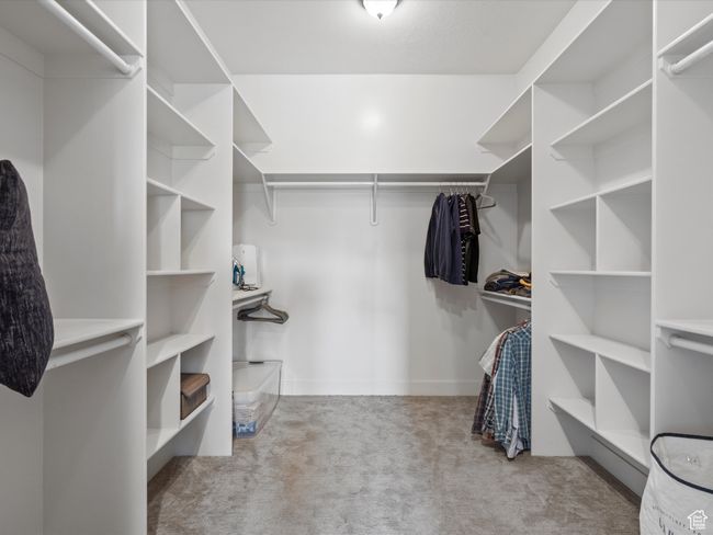 Walk in closet featuring carpet floors | Image 30