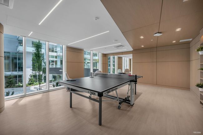 Recreation room with floor to ceiling windows and light wood-type flooring | Image 36