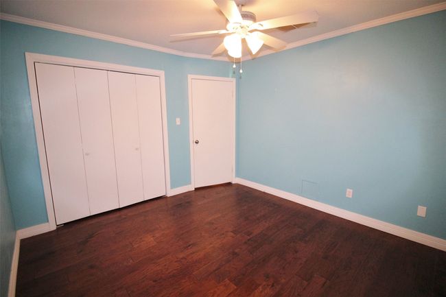 Guest Bedroom 2: Closet has built-in shoe rack | Image 24