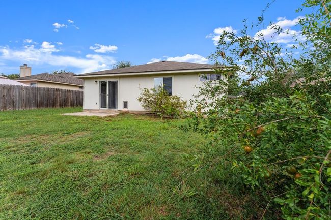 Back of house with stucco siding and a patio | Image 24