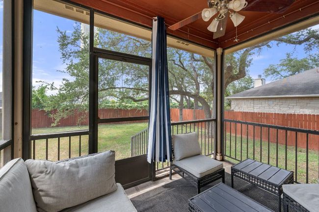 Sunroom / solarium featuring a ceiling fan and an outdoor hangout area | Image 29