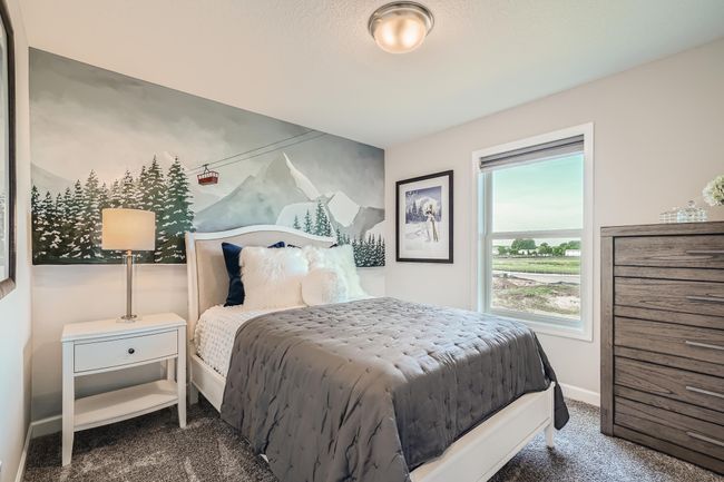 Photo is of the model. One of the secondary bedrooms that comes perfectly sized with a spacious closet. | Image 16