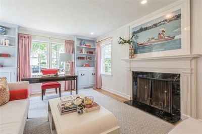 Dining space featuring light hardwood / wood-style flooring, crown molding, and a chandelier | Image 2