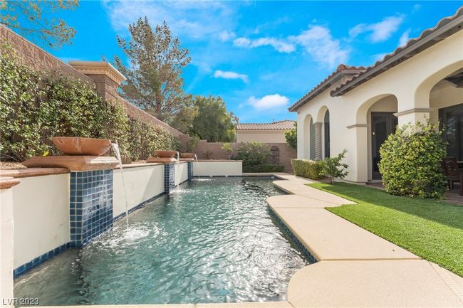 Pool features fountains and loggia to the right. | Image 16