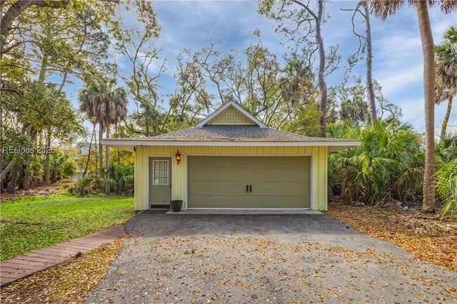 Front view of home's detached garage with large & spacious driveway and seperate garage. | Image 5