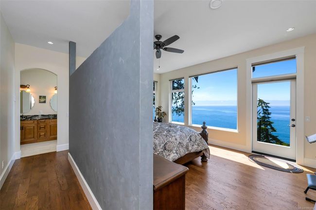 Bedroom featuring dark wood-style flooring, recessed lighting, ceiling fan, and access to outside | Image 34