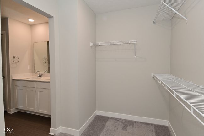spacious closet with a sink | Image 47