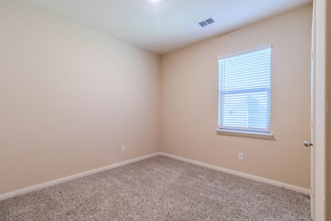 Carpeted empty room with a wealth of natural light | Image 19