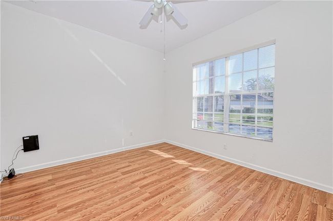 Spare room featuring light hardwood / wood-style floors and ceiling fan | Image 4