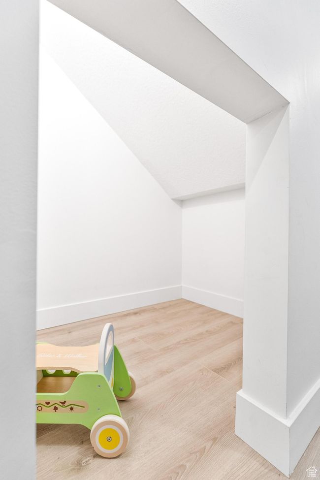 Rec room with baseboards and wood finished floors | Image 42