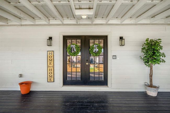 Welcoming double doors invite you into the main home, where thoughtful updates and open living spaces await. | Image 6
