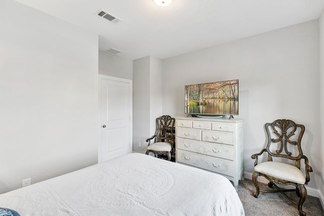 Serene and inviting, this bedroom is filled with natural light and styled with elegant finishes and calming tones—creating the perfect space for rest and relaxation. | Image 34