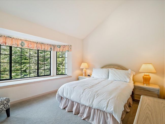 Bedroom with carpet, baseboards, and vaulted ceiling | Image 15