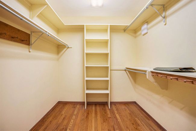 Walk-in closet next to garage interior door | Image 27