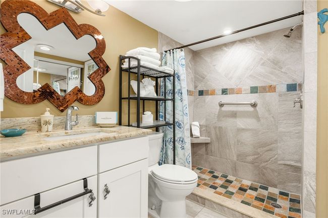 Full bath featuring vanity and a tile shower | Image 16