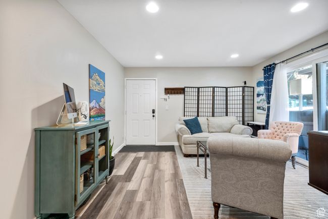 Living room with wood finished floors and recessed lighting | Image 10