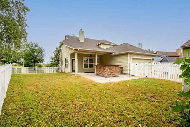 View of your back yard with an attached garage and storage shed | Image 28