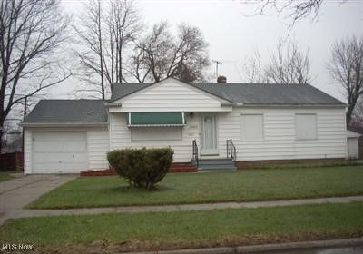 View of front of house with a garage and a front yard | Image 1