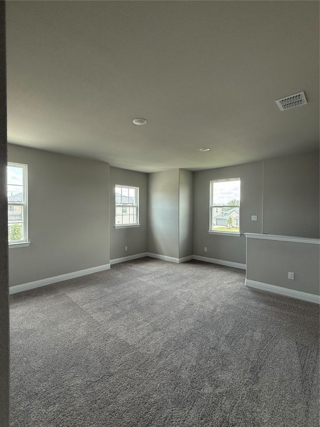 Carpeted spare room featuring baseboards and recessed lighting | Image 16