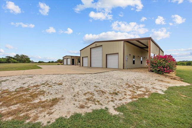 Garage featuring a detached garage | Image 5