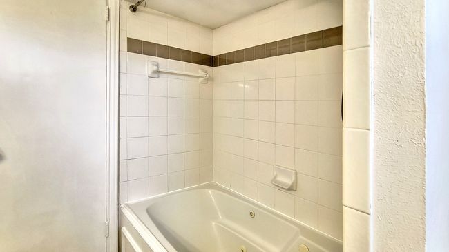 Bathroom featuring tiled shower / bath combo | Image 22