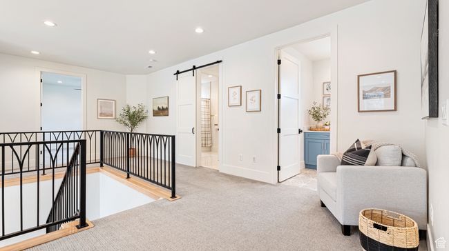 Sitting room featuring recessed lighting, carpet, an upstairs landing, and a barn door | Image 40