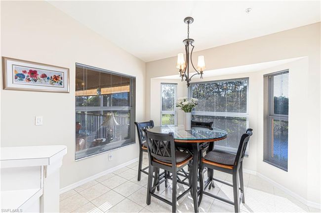 Tiled Eat in Kitchen area with a chandelier and lofted ceiling | Image 7